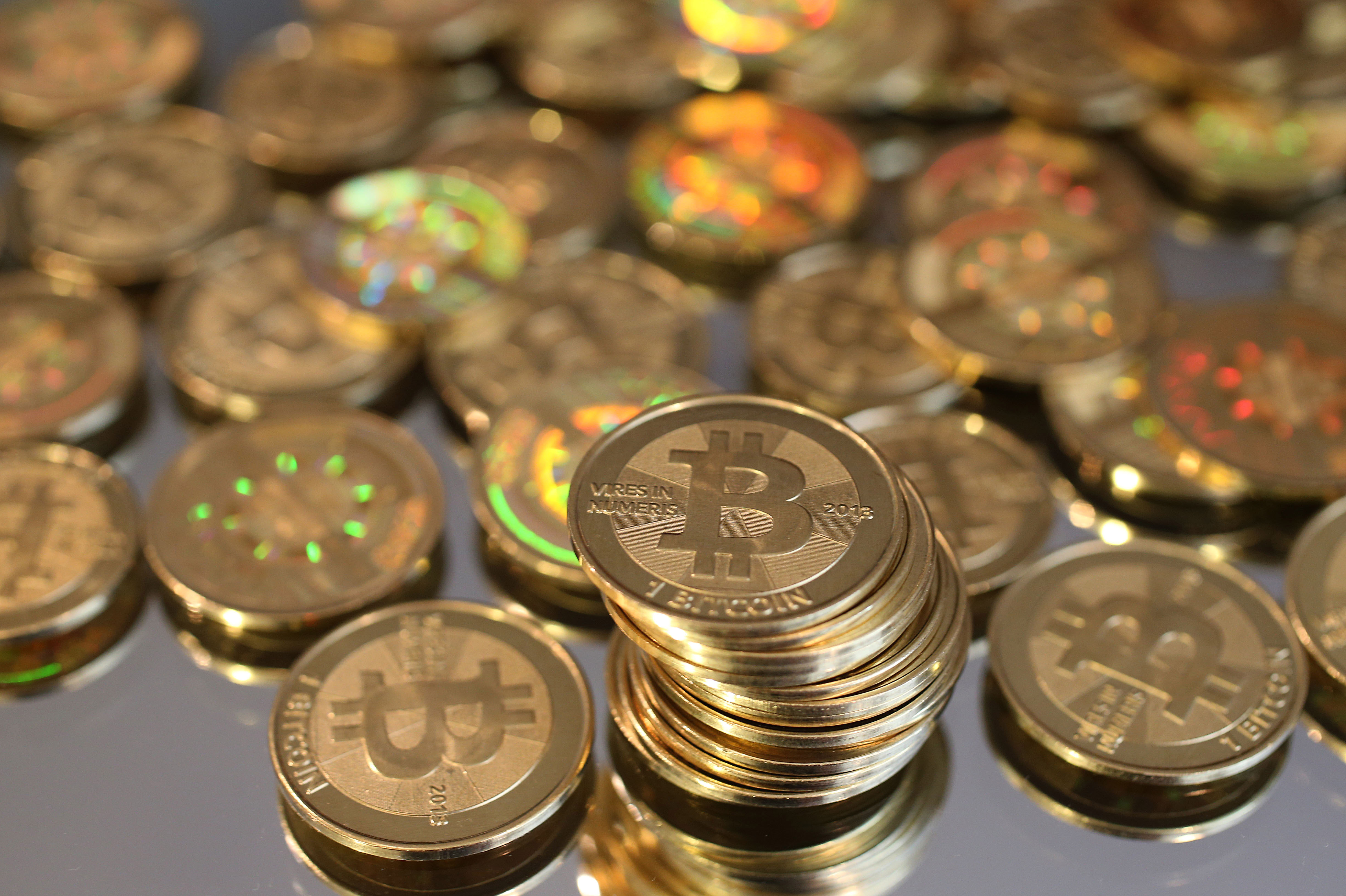 Bitcoin scorches past $57, as big buyers flock in | Reuters