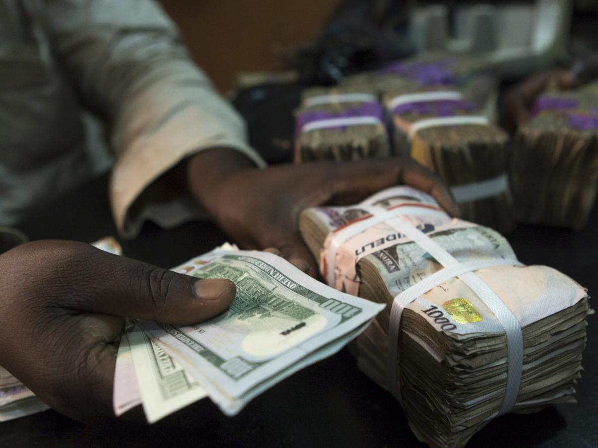 Explainer: What is pushing the Nigerian naira to record lows? | Reuters