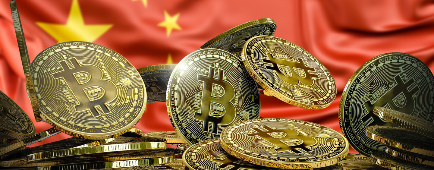 Bruised by stock market, Chinese rush into banned bitcoin | Reuters