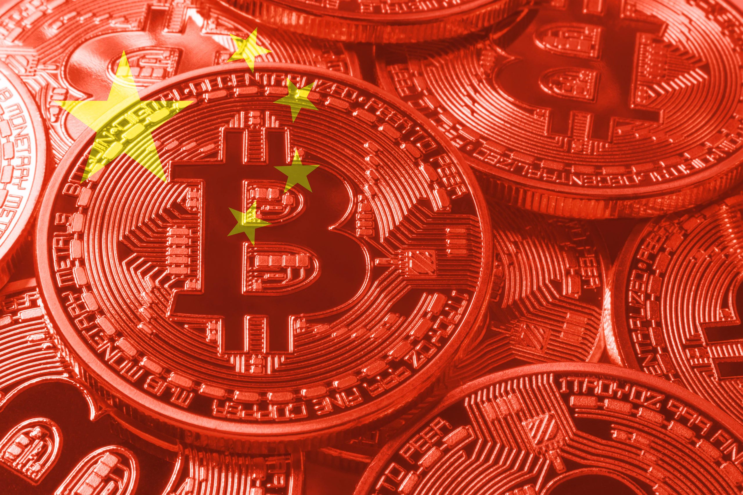 Bruised by stock market, Chinese rush into banned bitcoin | Reuters