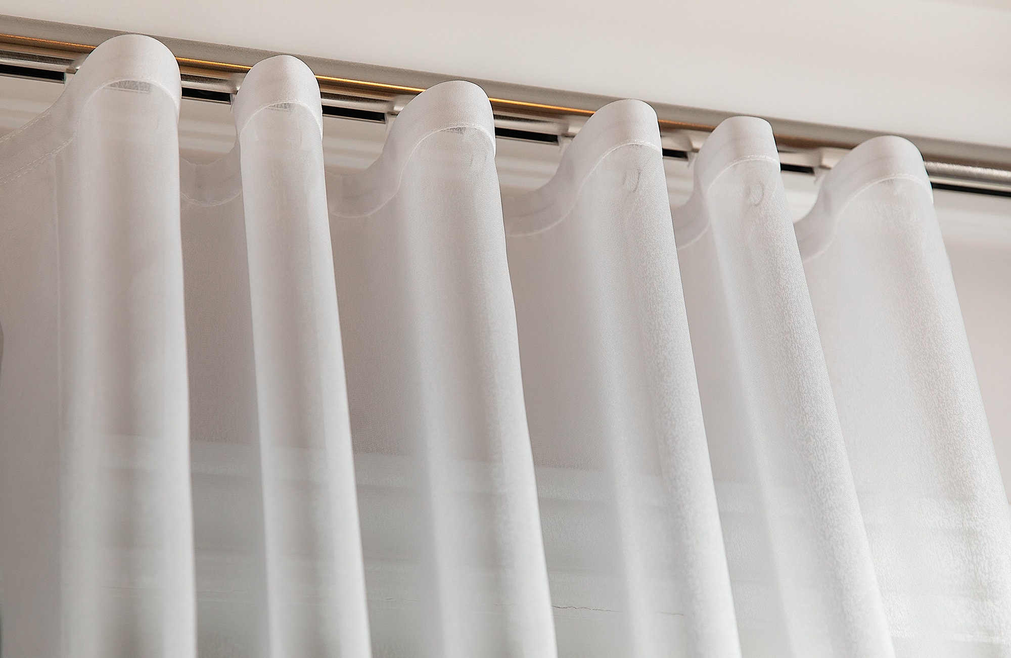 Ripplefold vs. Wave Fold Draperies – Curtain Rod Connection