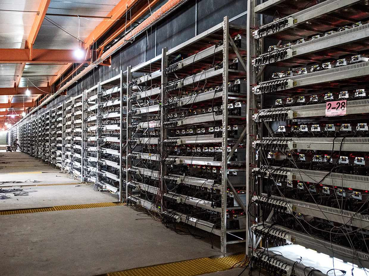 China's ban forces some bitcoin miners to flee overseas, others sell out | Reuters