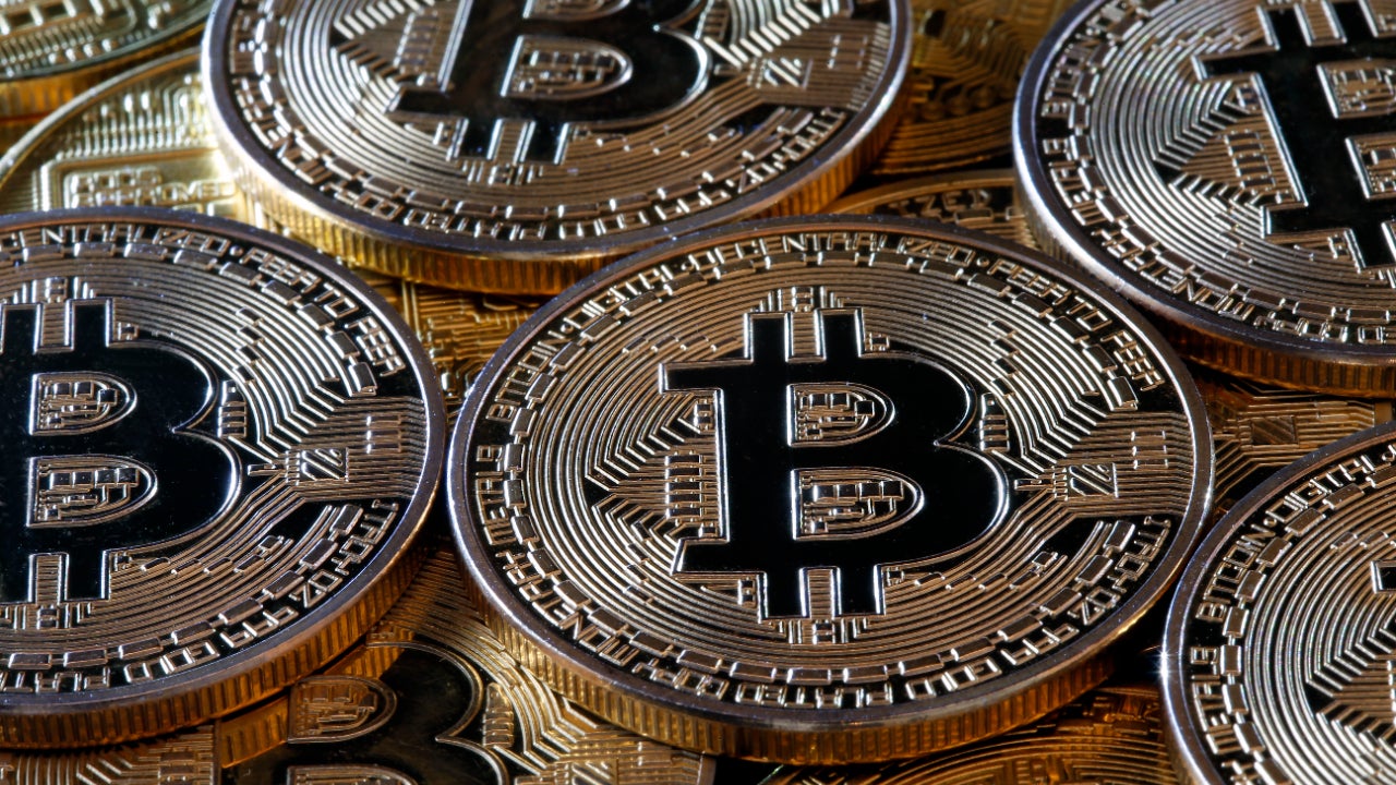 Bubble or brave new world? Bitcoin breaks $10, barrier