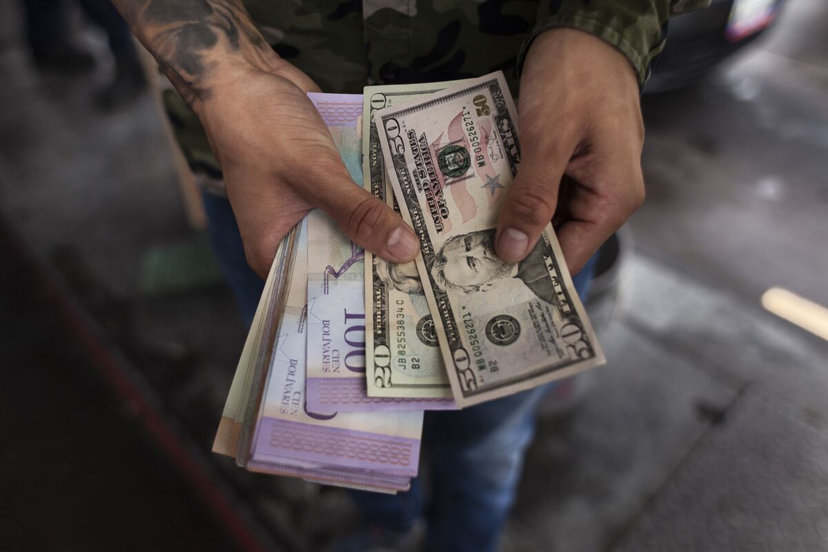 Venezuela's bolivar depreciates to 20 per dollar as prices rise | Reuters